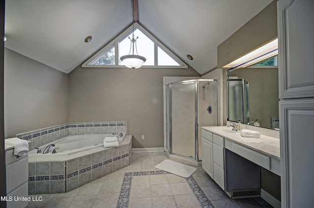 bathroom with vanity, tile patterned floors, vaulted ceiling, and shower with separate bathtub