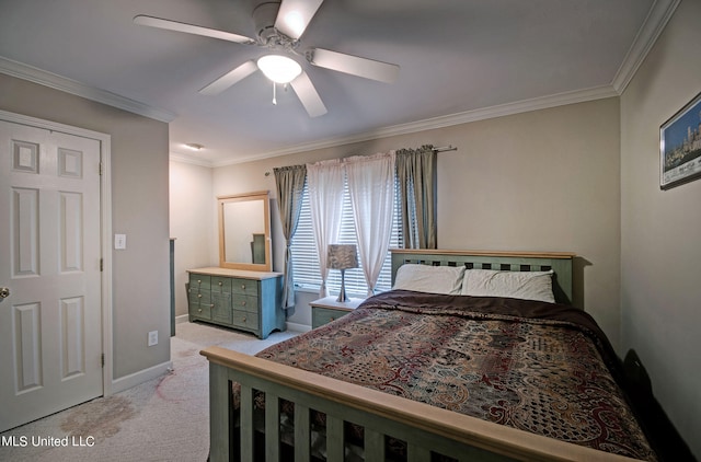 carpeted bedroom featuring ceiling fan and ornamental molding