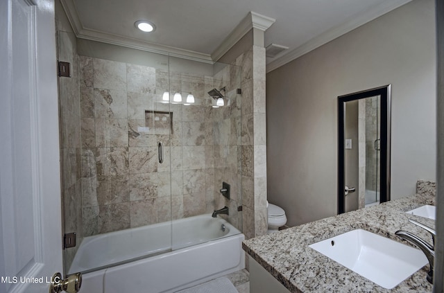 full bathroom featuring vanity, crown molding, bath / shower combo with glass door, and toilet