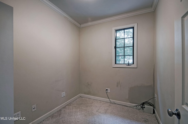 carpeted empty room featuring ornamental molding