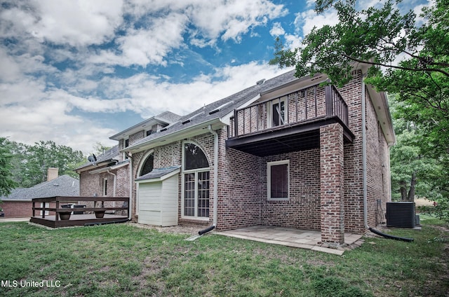 back of house with a yard, a patio, and central AC unit