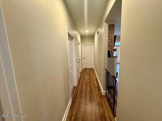 hall featuring dark wood-type flooring