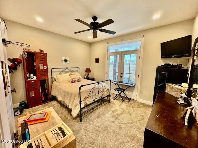 bedroom featuring access to outside, french doors, light colored carpet, and ceiling fan