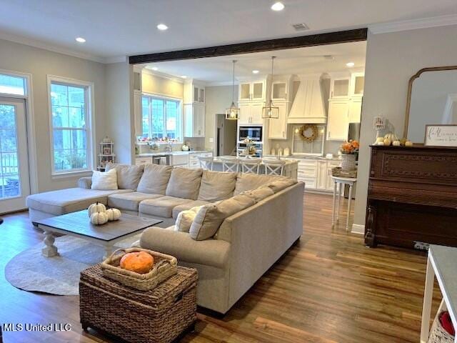 living room featuring ornamental molding and hardwood / wood-style flooring