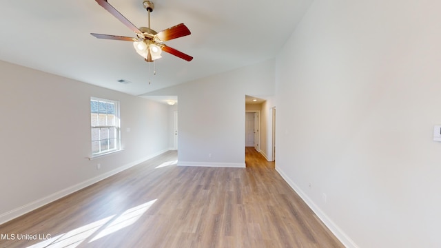 unfurnished room with light wood-type flooring, ceiling fan, and lofted ceiling