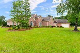123 Munich Dr, Madison, MS 39110 - view of front facade featuring a front yard