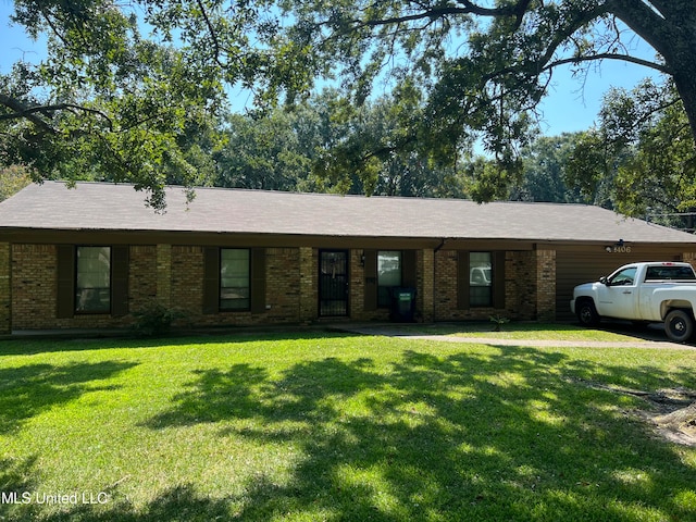 ranch-style house with a front lawn