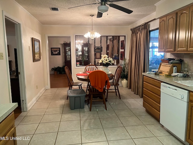 dining area featuring crown molding, light tile patterned flooring, a textured ceiling, and ceiling fan with notable chandelier