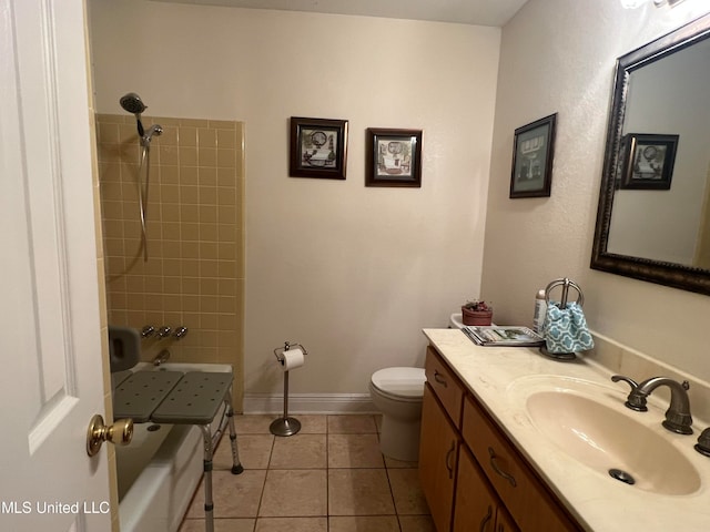 full bathroom featuring vanity, tiled shower / bath, toilet, and tile patterned flooring