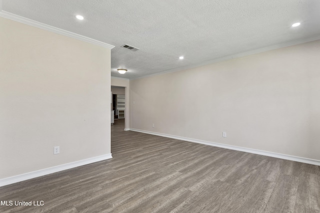 empty room featuring visible vents, recessed lighting, a textured ceiling, and wood finished floors