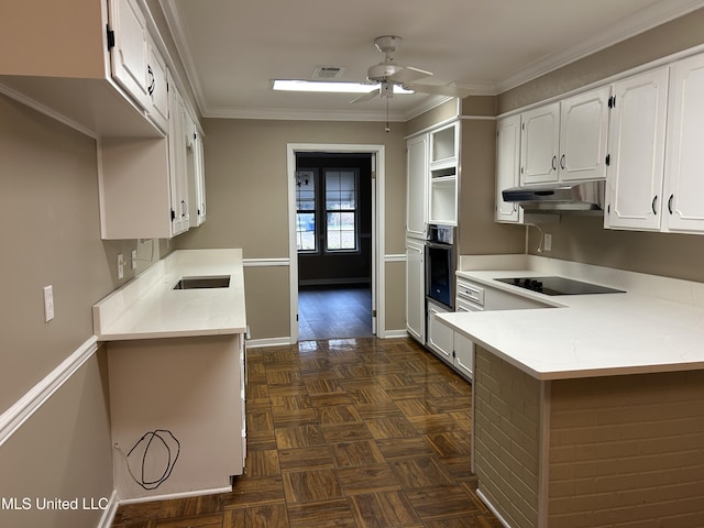 kitchen featuring oven, ceiling fan, black electric cooktop, ornamental molding, and white cabinetry