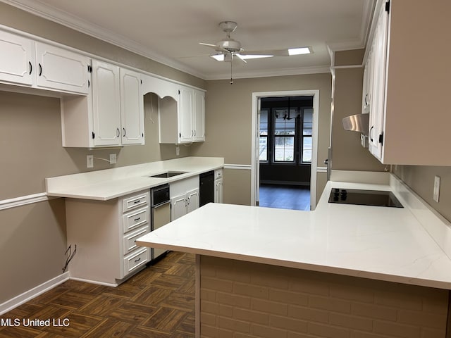 kitchen featuring kitchen peninsula, dark parquet floors, ceiling fan, white cabinets, and range hood