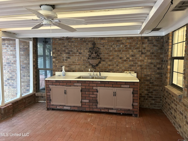 interior space featuring ceiling fan and sink