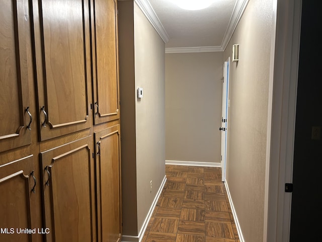 hall with dark parquet flooring and crown molding