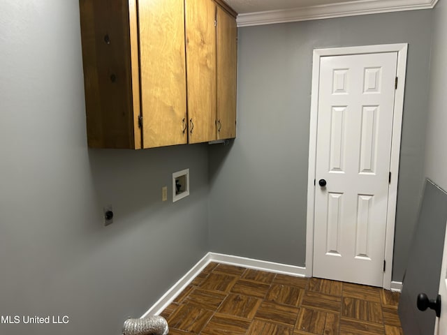 washroom featuring dark parquet flooring, cabinets, electric dryer hookup, hookup for a washing machine, and ornamental molding