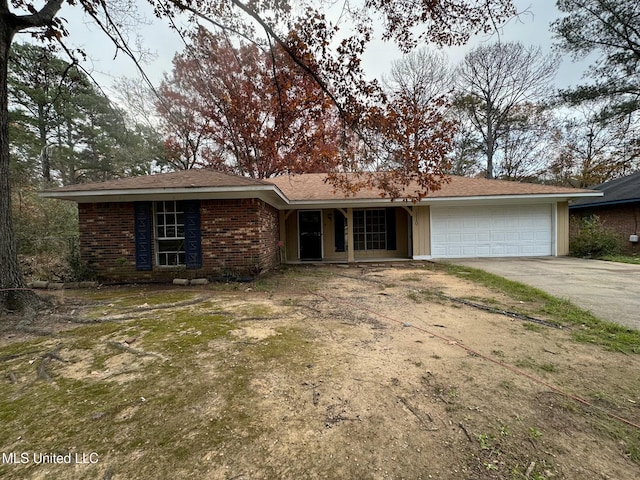 ranch-style house featuring a garage