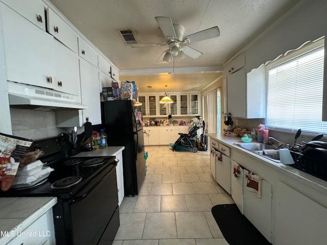 kitchen featuring black appliances, hanging light fixtures, ceiling fan, a textured ceiling, and white cabinetry