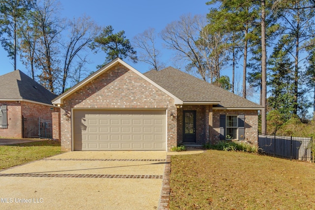 view of front of home featuring a garage and a front lawn