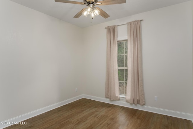 empty room featuring dark hardwood / wood-style floors and ceiling fan