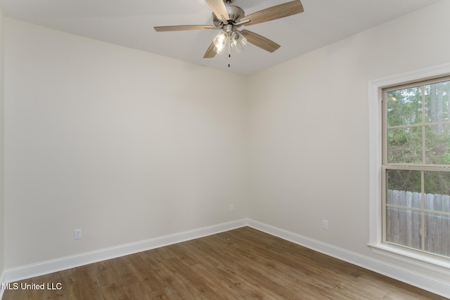 unfurnished room featuring ceiling fan and dark hardwood / wood-style floors