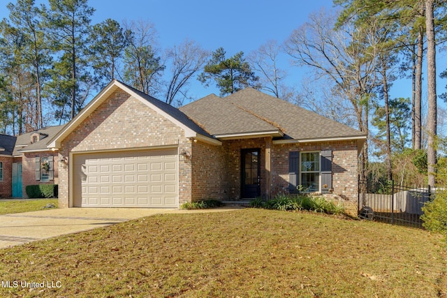 view of front of property with a garage and a front yard