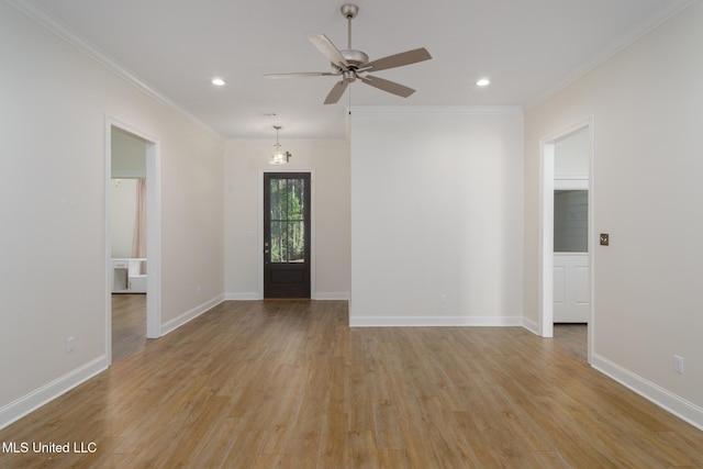 entrance foyer featuring ceiling fan, ornamental molding, and light hardwood / wood-style flooring