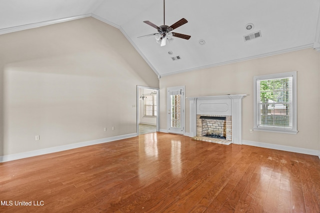 unfurnished living room featuring a ceiling fan, wood finished floors, a fireplace, baseboards, and high vaulted ceiling