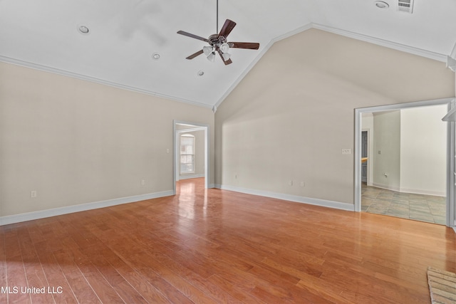 empty room with a ceiling fan, light wood finished floors, crown molding, high vaulted ceiling, and baseboards