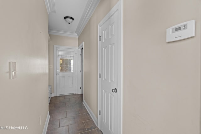 corridor featuring ornamental molding and baseboards