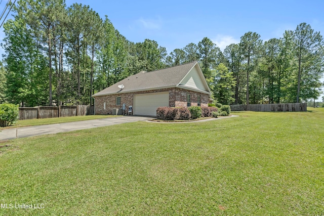 view of side of property with driveway, brick siding, a garage, and central AC unit