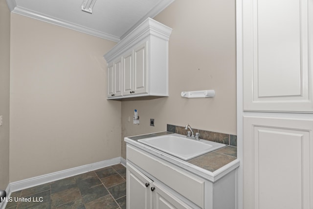 laundry room with stone finish flooring, baseboards, cabinet space, hookup for an electric dryer, and crown molding