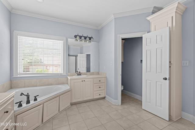 bathroom featuring crown molding, toilet, a garden tub, vanity, and tile patterned flooring