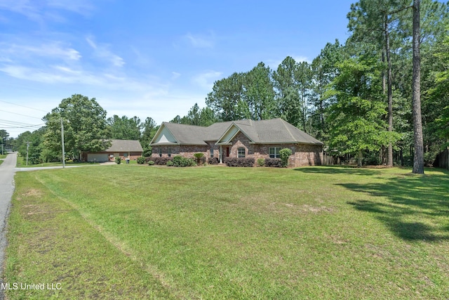 single story home with a front yard and driveway