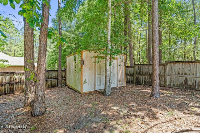 view of shed with a fenced backyard