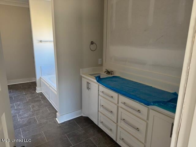 bathroom with vanity and a bathtub