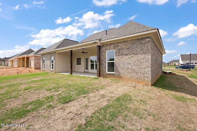 850 Glenwild Cir, Canton, MS 39046 - rear view of property with ceiling fan, a patio, a lawn, and brick siding
