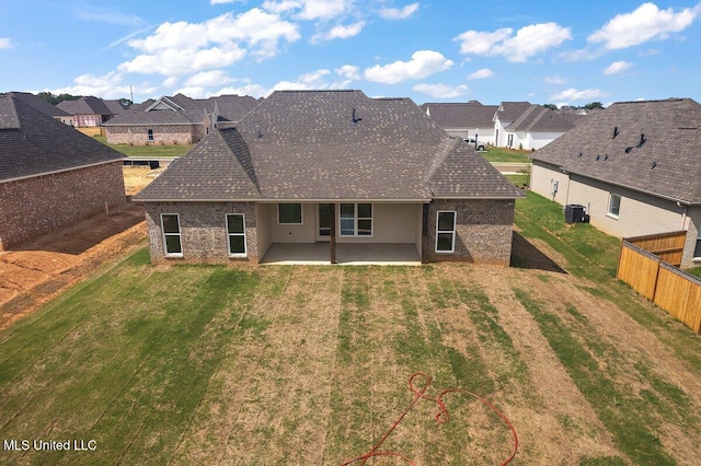 850 Glenwild Cir, Canton, MS 39046 - back of property featuring a patio area, a residential view, brick siding, central AC, and a shingled roof