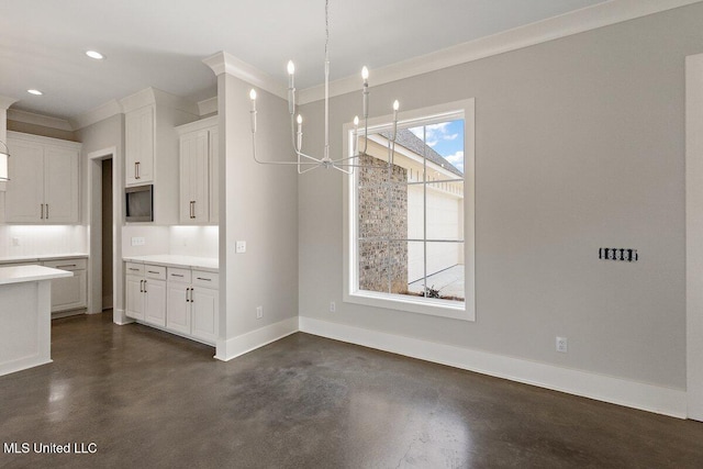 850 Glenwild Cir, Canton, MS 39046 - unfurnished dining area with finished concrete flooring, crown molding, baseboards, a chandelier, and recessed lighting
