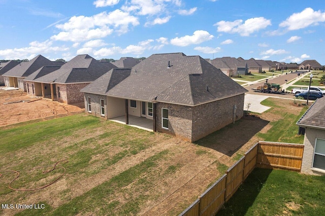 850 Glenwild Cir, Canton, MS 39046 - back of property featuring a residential view, a patio, brick siding, and roof with shingles