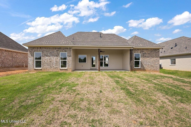 850 Glenwild Cir, Canton, MS 39046 - back of house featuring a patio, a yard, and roof with shingles