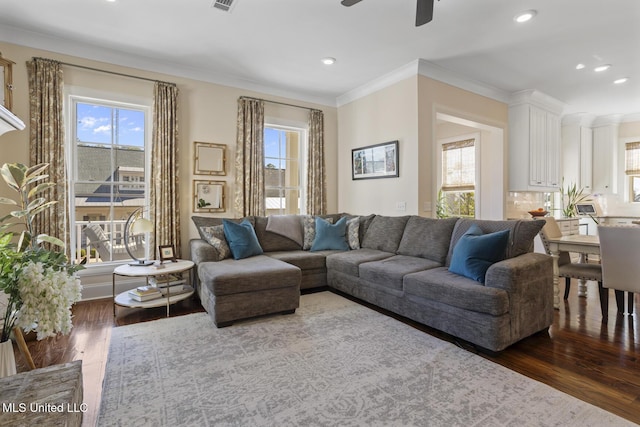 living room with plenty of natural light and wood finished floors