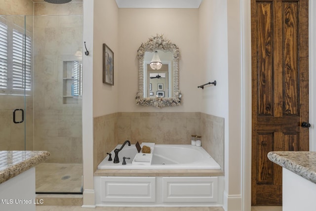 full bathroom featuring a stall shower and a garden tub