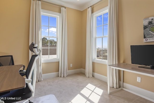 carpeted office space with baseboards