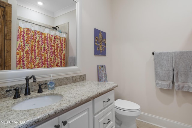 bathroom featuring curtained shower, toilet, vanity, tile patterned flooring, and baseboards