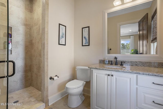 full bathroom with toilet, vanity, baseboards, tile patterned floors, and a stall shower