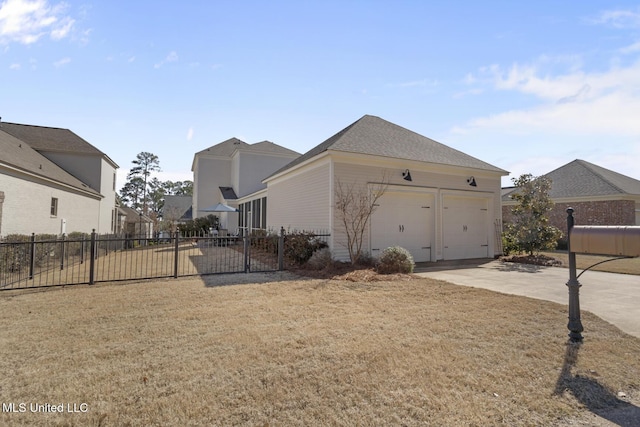 view of home's exterior featuring a garage, driveway, a yard, and fence