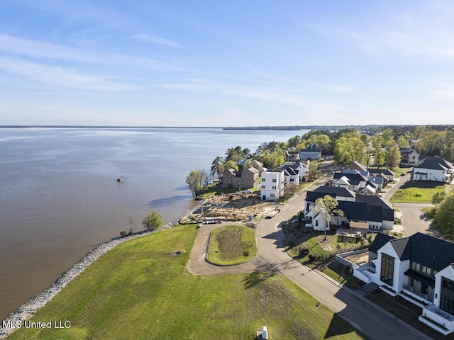 bird's eye view with a water view and a residential view