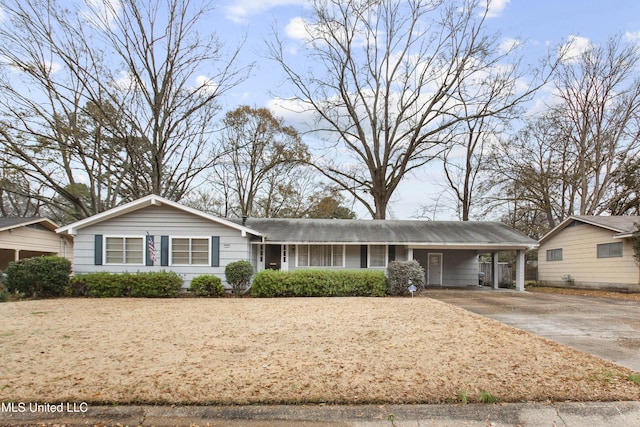 ranch-style house featuring a carport