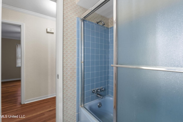 bathroom with enclosed tub / shower combo, ornamental molding, and wood-type flooring