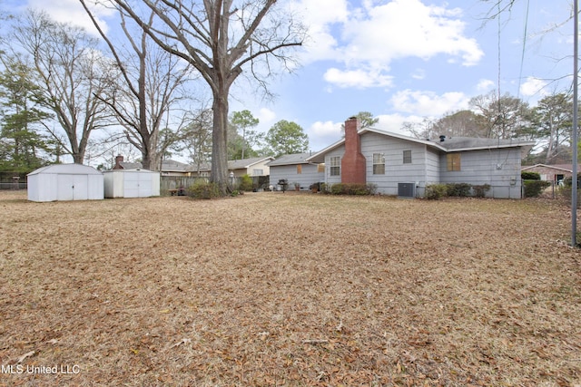 view of yard featuring cooling unit and a storage unit